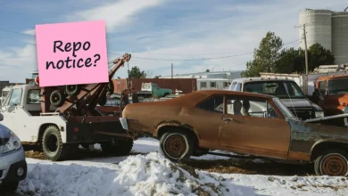 A tow truck hooked to an old rusty car in the snow, with a sticky note reading “Repo notice?”.